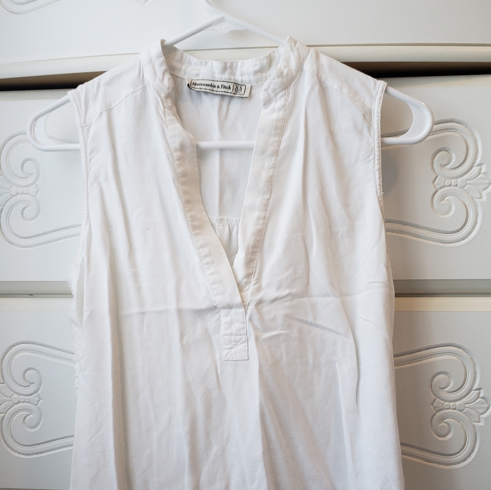 White sleeveless blouse